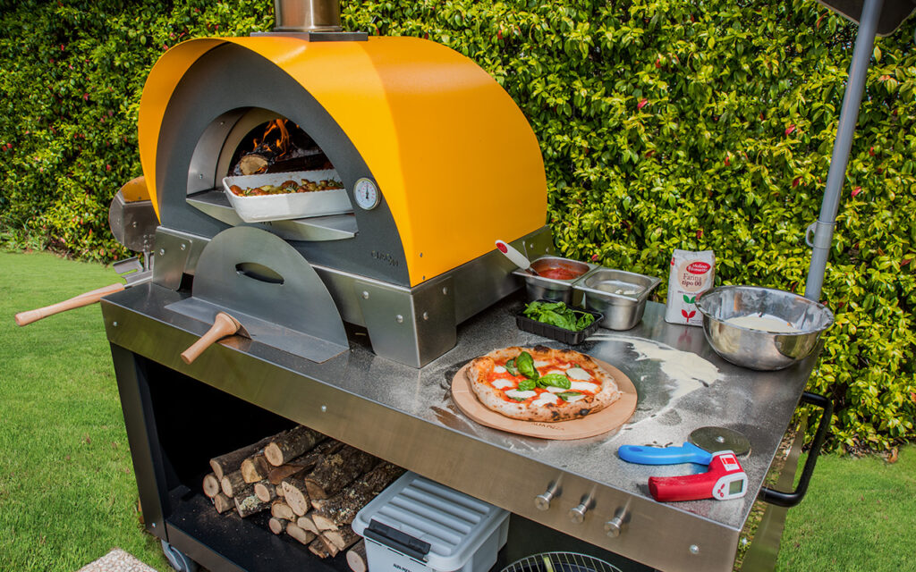 https://www.alfaforni.com/wp-content/uploads/2019/05/multi-functional-base-and-ciao-pizza-oven-wood-fired-oven-1-1024x640.jpg